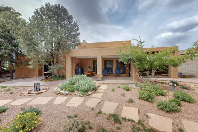 13108 Della Longa Ln NE, Albuquerque, NM 87111 - back of house featuring stucco siding