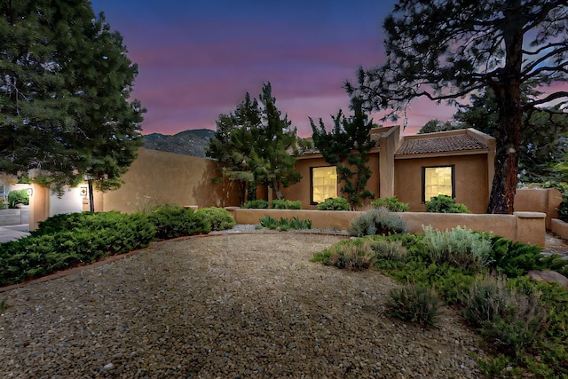 13108 Della Longa Ln NE, Albuquerque, NM 87111 - pueblo revival-style home with stucco siding and a tile roof