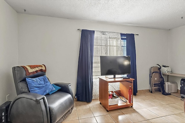 2800 Vail Ave SE Unit D113, Albuquerque, NM 87106 - sitting room with light tile patterned floors and a textured ceiling