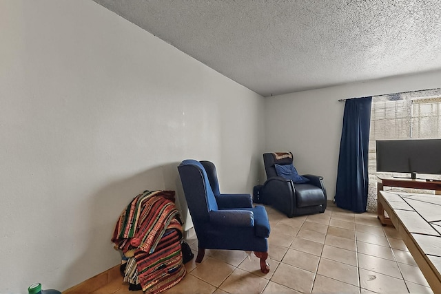 2800 Vail Ave SE Unit D113, Albuquerque, NM 87106 - living area with a textured ceiling and light tile patterned flooring
