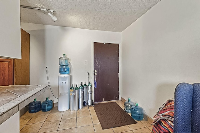 2800 Vail Ave SE Unit D113, Albuquerque, NM 87106 - foyer entrance with light tile patterned flooring and a textured ceiling
