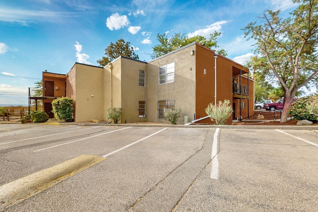 2800 Vail Ave SE Unit D113, Albuquerque, NM 87106 - view of property featuring uncovered parking