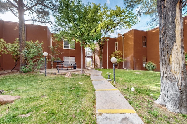 2800 Vail Ave SE Unit D113, Albuquerque, NM 87106 - view of green lawn featuring a patio