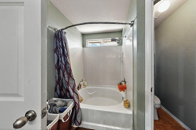 7720 Red Finch Ct NW, Albuquerque, NM 87114 - full bath with tile patterned floors, toilet, a textured wall, and shower / tub combo