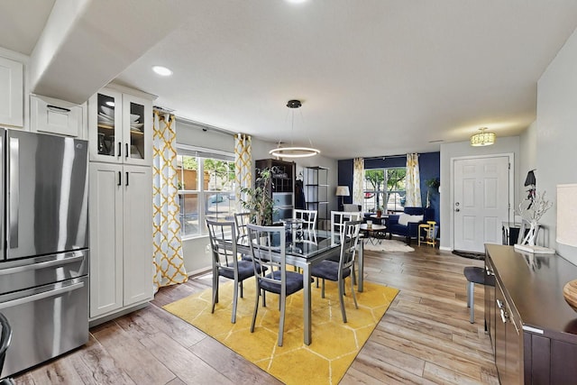 7720 Red Finch Ct NW, Albuquerque, NM 87114 - dining space with healthy amount of natural light, light wood finished floors, baseboards, and recessed lighting