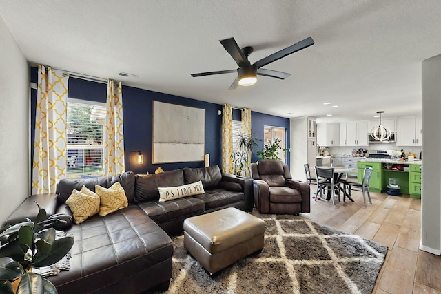 7720 Red Finch Ct NW, Albuquerque, NM 87114 - living area with light wood-type flooring and ceiling fan
