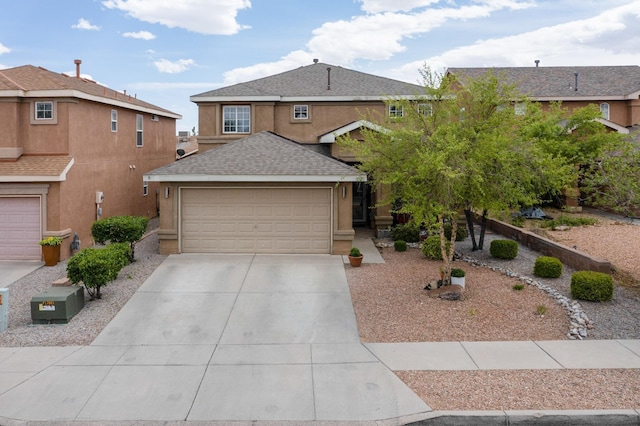 7720 Red Finch Ct NW, Albuquerque, NM 87114 - traditional home featuring concrete driveway, a garage, and stucco siding