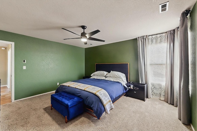 7720 Red Finch Ct NW, Albuquerque, NM 87114 - carpeted bedroom featuring a textured ceiling, a ceiling fan, and baseboards
