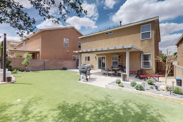 7720 Red Finch Ct NW, Albuquerque, NM 87114 - back of house with stucco siding, a fenced backyard, a patio, and a putting green