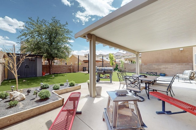 7720 Red Finch Ct NW, Albuquerque, NM 87114 - view of patio featuring a shed, an outbuilding, and a residential view