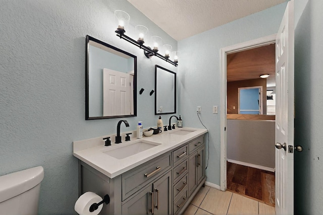 7720 Red Finch Ct NW, Albuquerque, NM 87114 - full bath with toilet, double vanity, and tile patterned floors