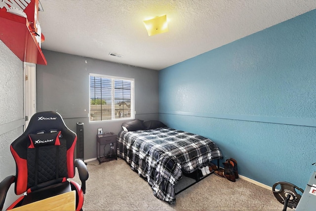 7720 Red Finch Ct NW, Albuquerque, NM 87114 - carpeted bedroom with a textured wall, baseboards, and a textured ceiling