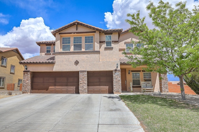 3929 Las Colinas Ave, Rio Rancho, NM 87124 - view of front facade featuring concrete driveway, stucco siding, a garage, a tiled roof, and stone siding