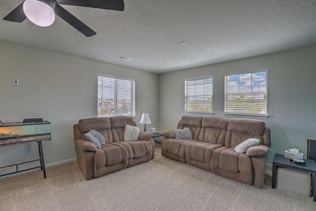 3929 Las Colinas Ave, Rio Rancho, NM 87124 - living room featuring carpet floors, a ceiling fan, a textured ceiling, and baseboards
