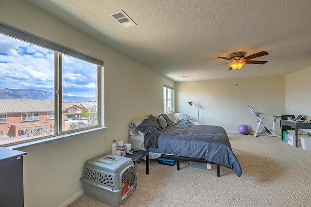 3929 Las Colinas Ave, Rio Rancho, NM 87124 - bedroom featuring carpet, a textured ceiling, baseboards, and ceiling fan