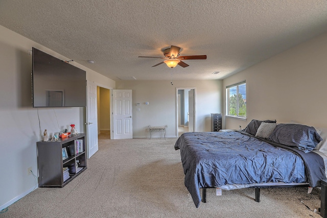 3929 Las Colinas Ave, Rio Rancho, NM 87124 - bedroom with carpet floors, a textured ceiling, ceiling fan, and baseboards
