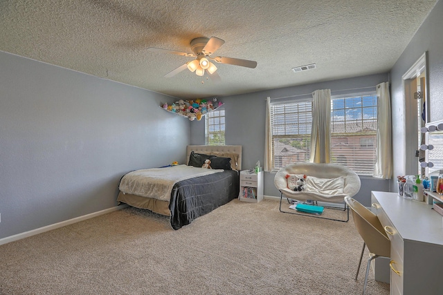 3929 Las Colinas Ave, Rio Rancho, NM 87124 - carpeted bedroom featuring a ceiling fan, a textured ceiling, and baseboards