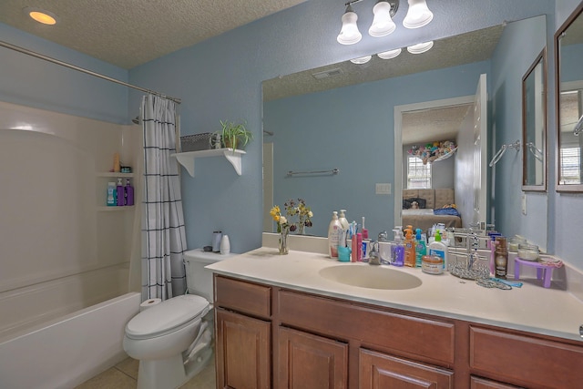 3929 Las Colinas Ave, Rio Rancho, NM 87124 - ensuite bathroom featuring a textured ceiling, toilet, vanity, tile patterned floors, and shower / bath combo