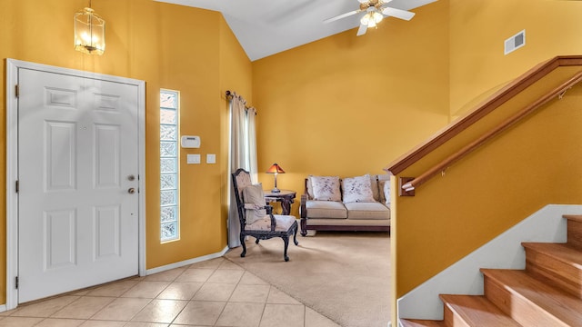 4212 Caprock Rd NW, Albuquerque, NM 87114 - entryway featuring stairs, light tile patterned floors, ceiling fan, plenty of natural light, and high vaulted ceiling