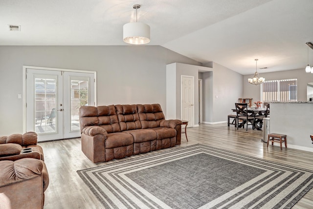 6605 Country Knoll Ct NW, Albuquerque, NM 87114 - living area with light wood-style flooring, lofted ceiling, french doors, a chandelier, and baseboards
