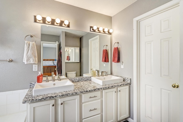 6605 Country Knoll Ct NW, Albuquerque, NM 87114 - ensuite bathroom with double vanity and toilet