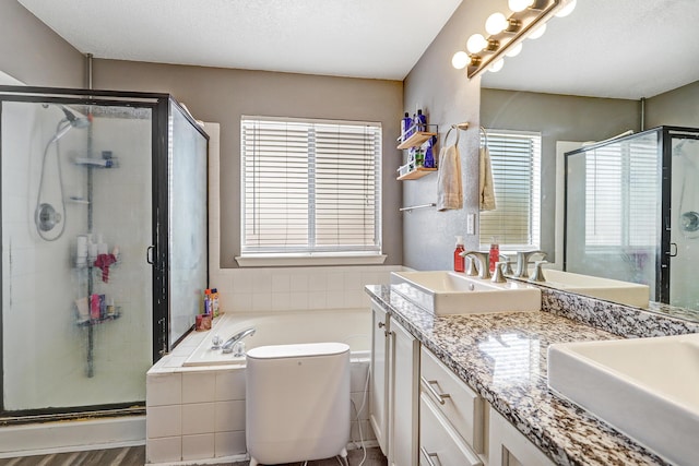 6605 Country Knoll Ct NW, Albuquerque, NM 87114 - bathroom with a bath, a shower stall, and double vanity