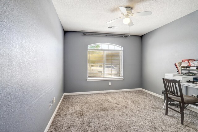 6605 Country Knoll Ct NW, Albuquerque, NM 87114 - carpeted office space featuring a ceiling fan, a textured ceiling, baseboards, and a textured wall
