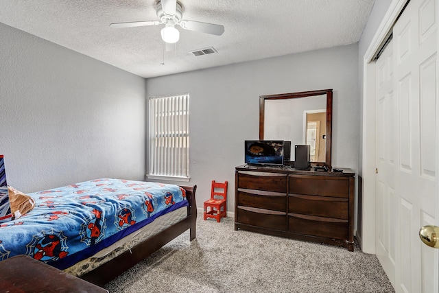 6605 Country Knoll Ct NW, Albuquerque, NM 87114 - bedroom featuring carpet flooring, a textured ceiling, a closet, and ceiling fan