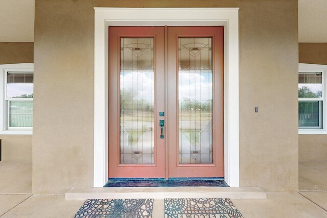 70 Sanchez Rd, Belen, NM 87002 - entrance to property featuring french doors and stucco siding