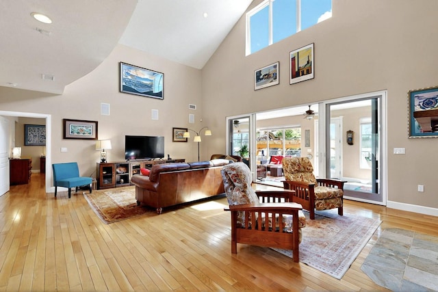 70 Sanchez Rd, Belen, NM 87002 - living area with high vaulted ceiling, light wood finished floors, healthy amount of natural light, baseboards, and a ceiling fan