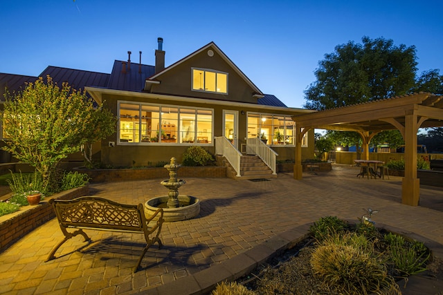 70 Sanchez Rd, Belen, NM 87002 - rear view of house with a standing seam roof, a patio area, metal roof, and stucco siding