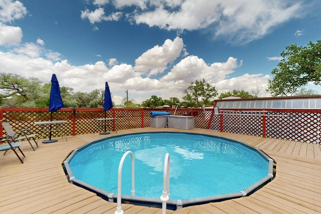 view of pool with a deck
