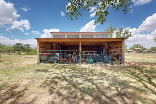 view of pole building with fence