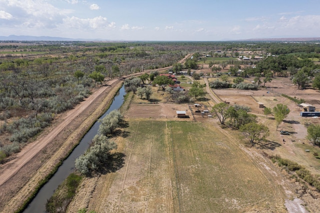 aerial view of property and surrounding area featuring a large body of water and rural landscape