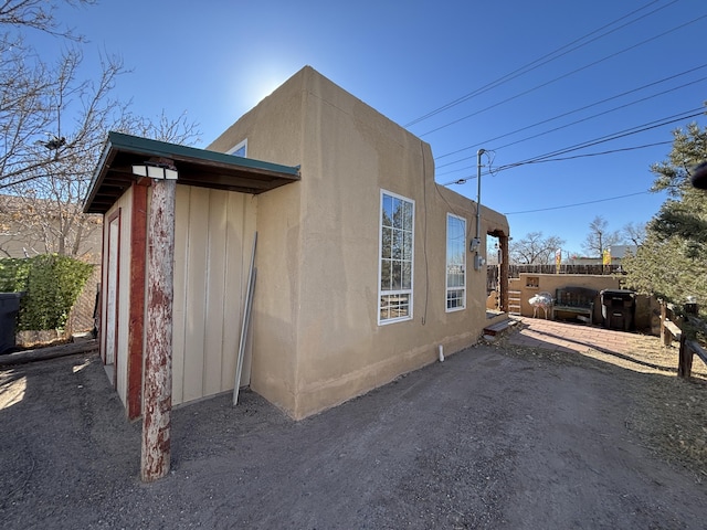 1816 Isleta Blvd SW, Albuquerque, NM 87105 - view of side of home with a patio