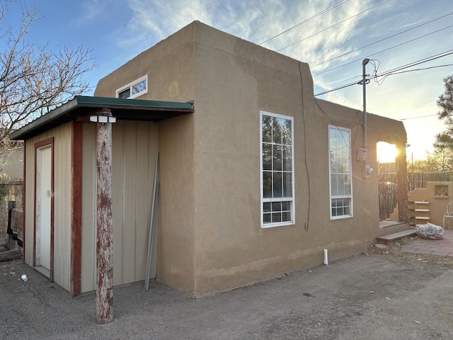 1816 Isleta Blvd SW, Albuquerque, NM 87105 - view of side of home featuring stucco siding
