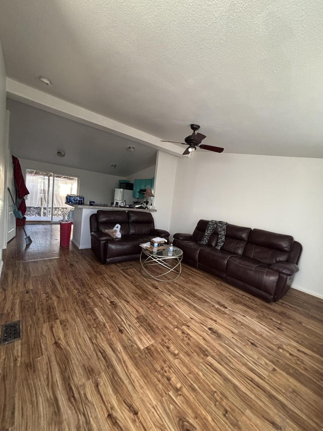 1816 Isleta Blvd SW, Albuquerque, NM 87105 - living room featuring dark wood finished floors, lofted ceiling, a textured ceiling, and a ceiling fan