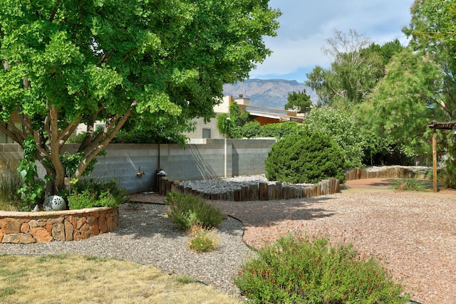 6400 Torreon Dr NE, Albuquerque, NM 87109 - view of yard featuring fence and a mountain view