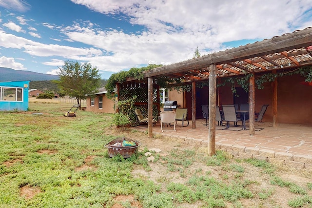 5 Francisco Rd, Cedar Crest, NM 87008 - view of grassy yard featuring a fire pit, a pergola, a patio, a mountain view, and outdoor dining space