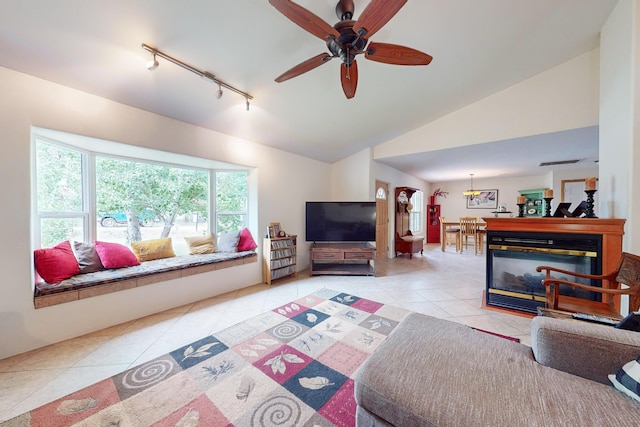 5 Francisco Rd, Cedar Crest, NM 87008 - living area with track lighting, tile patterned floors, a ceiling fan, and vaulted ceiling