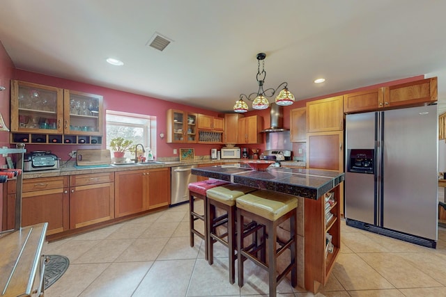 5 Francisco Rd, Cedar Crest, NM 87008 - kitchen featuring stainless steel appliances, light tile patterned floors, brown cabinets, and recessed lighting