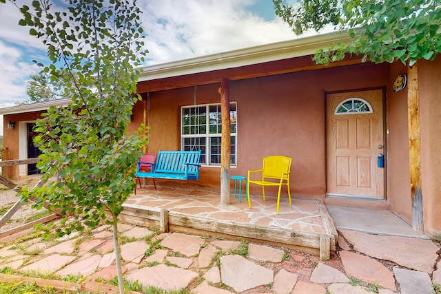 5 Francisco Rd, Cedar Crest, NM 87008 - doorway to property featuring covered porch and stucco siding