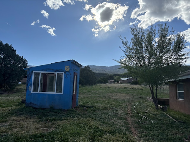 5 Francisco Rd, Cedar Crest, NM 87008 - view of green lawn featuring an outbuilding and a mountain view
