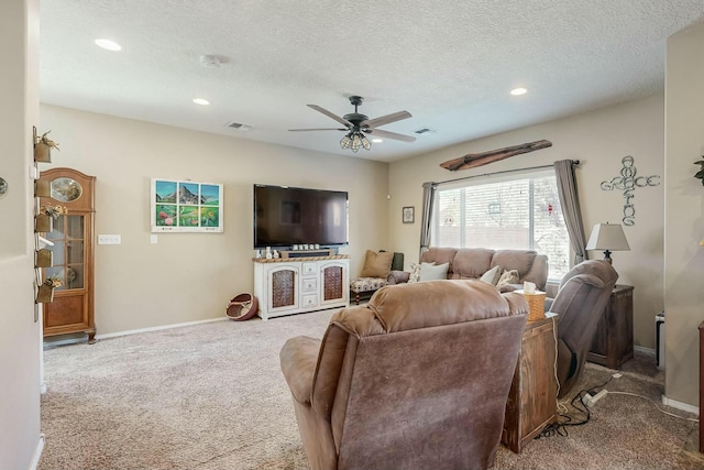 9631 Iron Rock Dr NW, Albuquerque, NM 87114 - carpeted living room featuring a ceiling fan, recessed lighting, and a textured ceiling