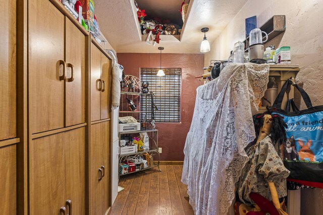 160 Black Bear Rd, Ramah, NM 87321 - bedroom with hardwood / wood-style flooring and a textured wall