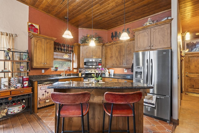 160 Black Bear Rd, Ramah, NM 87321 - kitchen with appliances with stainless steel finishes, wooden ceiling, a kitchen island, a breakfast bar area, and hanging light fixtures