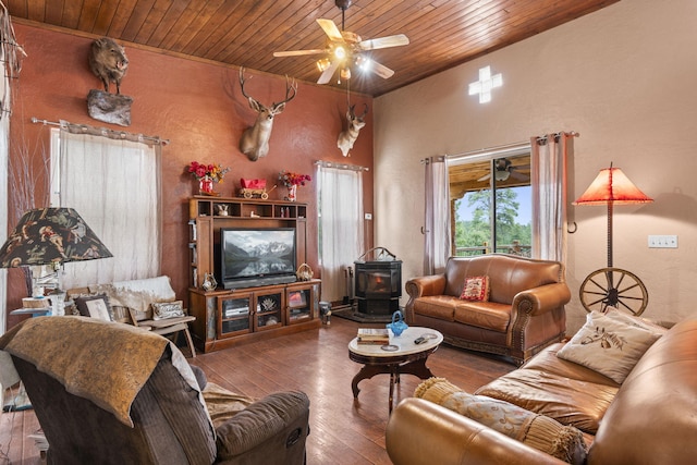 160 Black Bear Rd, Ramah, NM 87321 - living room featuring a wood stove, wood ceiling, ceiling fan, and hardwood / wood-style flooring