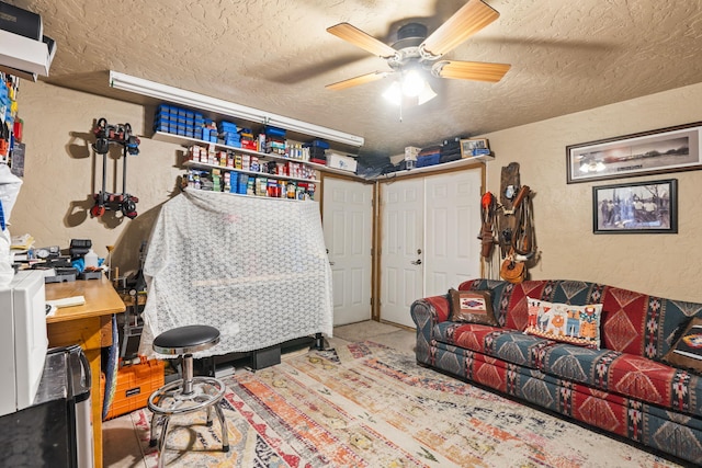 160 Black Bear Rd, Ramah, NM 87321 - living area with a textured wall, a textured ceiling, and a ceiling fan