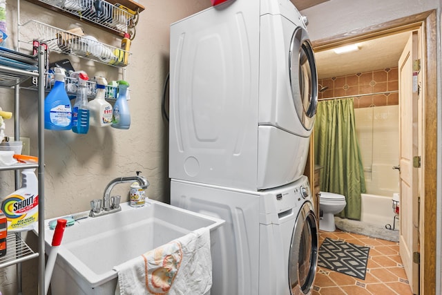 160 Black Bear Rd, Ramah, NM 87321 - washroom with stacked washer / drying machine and tile patterned flooring