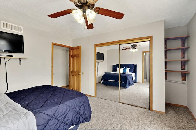 404 Pecos Loop SE, Rio Rancho, NM 87124 - bedroom featuring carpet flooring, a closet, a ceiling fan, and baseboards